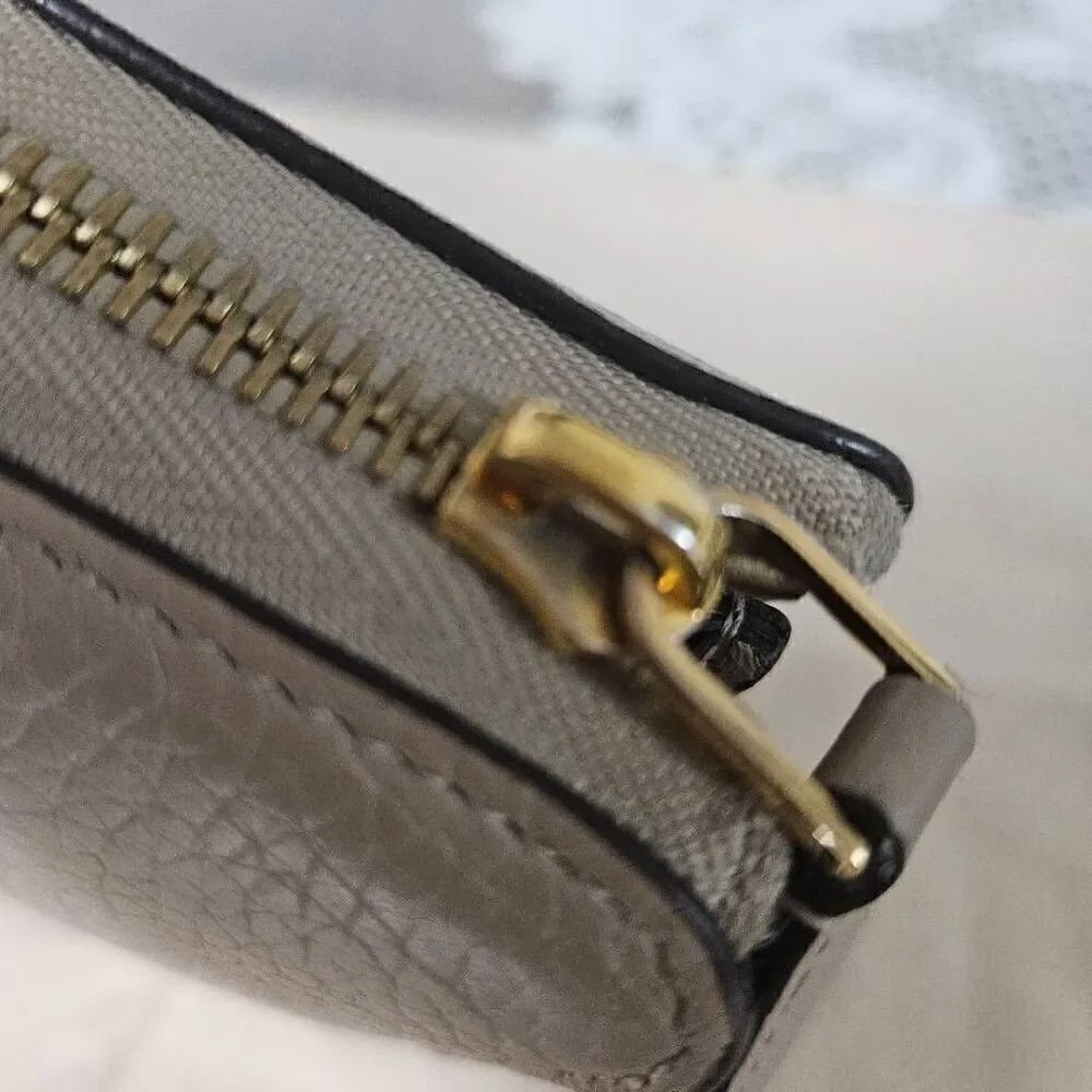 Louis Vuitton Taurillon portefeuille Comete long zip wallet
